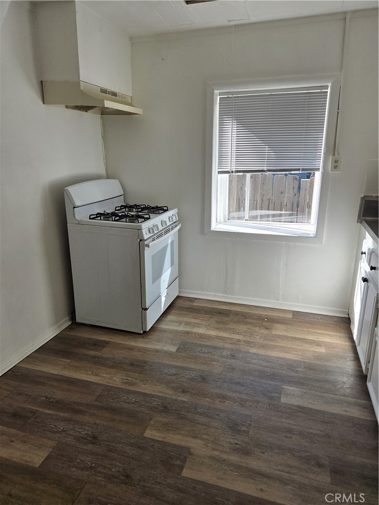 353 Highway 138 Crestline, CA 92325 - Photo 5 of 12 a view of an empty room with wooden floor and a window