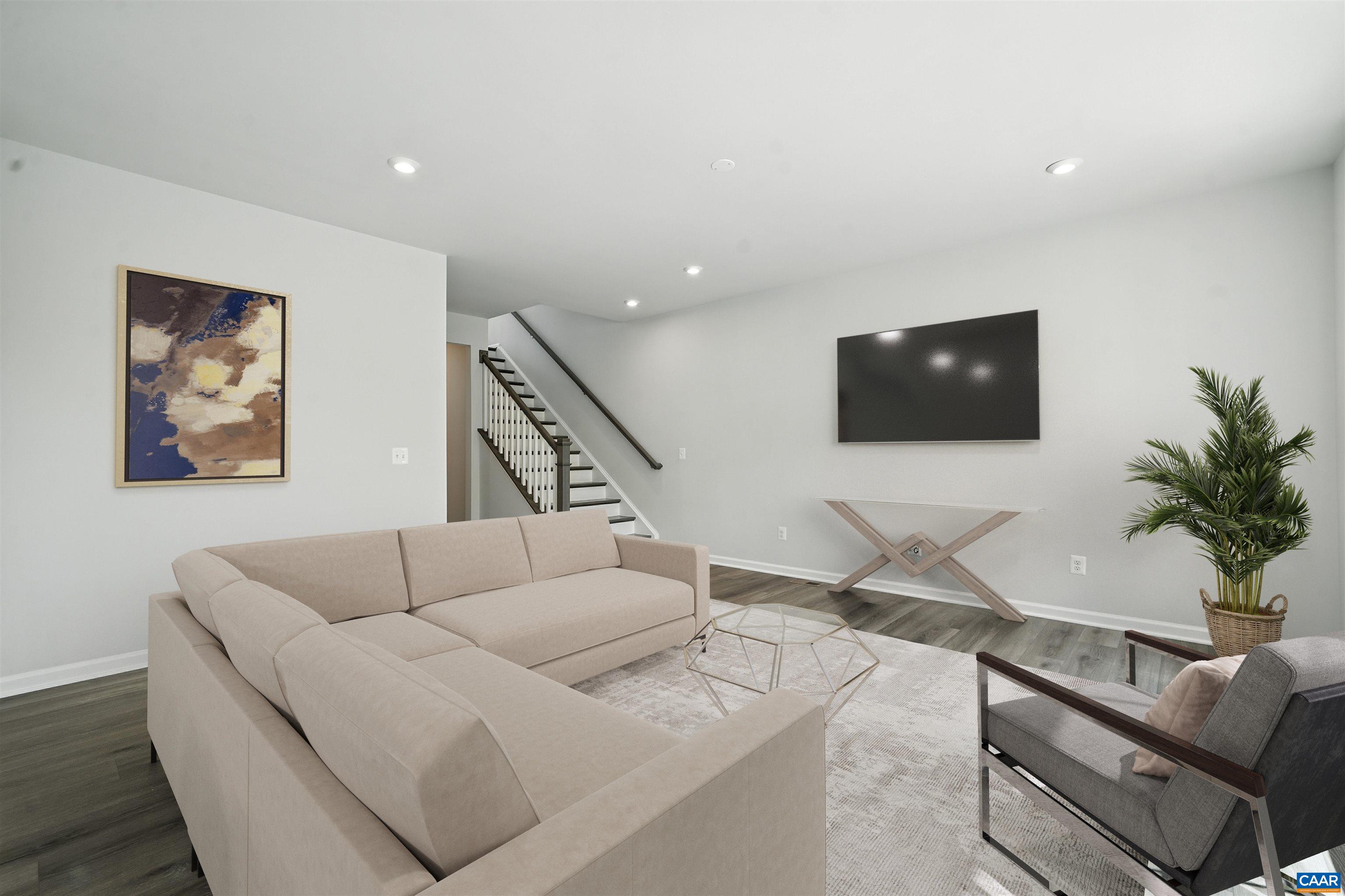 2981 Rambling Brk Lane Crozet, VA 22932 - Photo 7 of 37 a living room with furniture and a flat screen tv