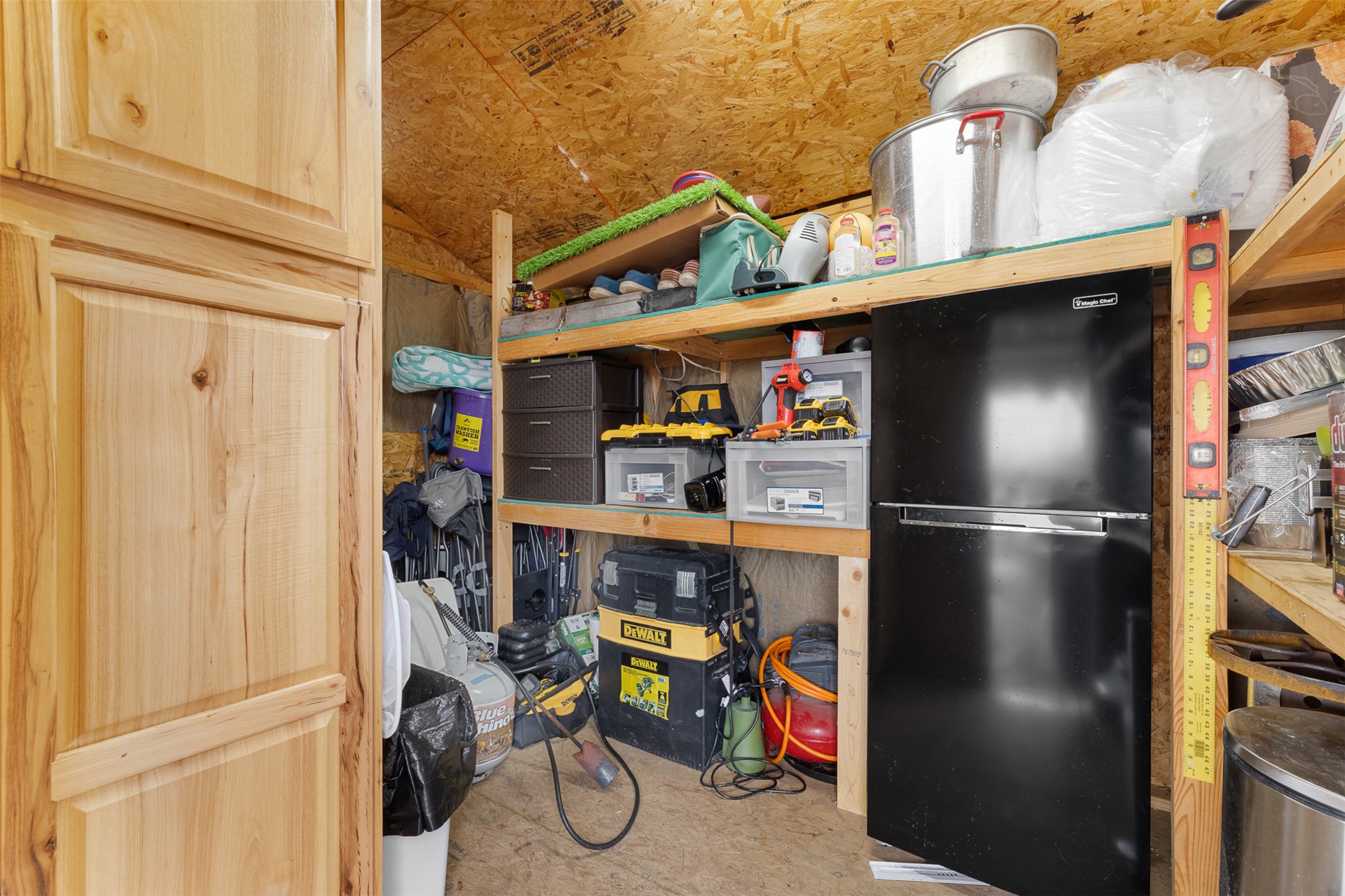 149 Windmill Road Somerville, TX 77879 - Photo 24 of 31 a kitchen with a refrigerator and a table