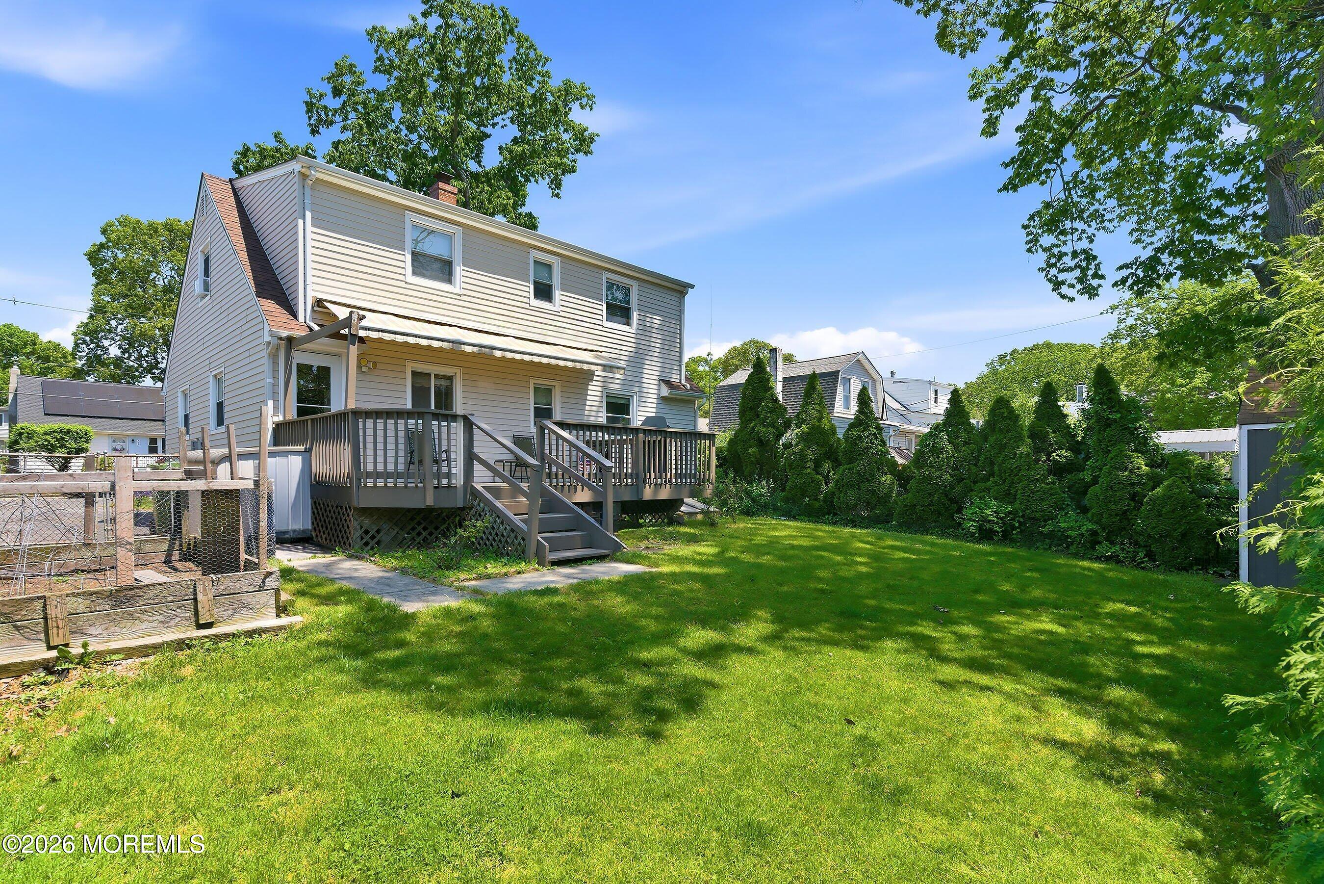 412 Moore Road Neptune Township, NJ 07753 - Photo 29 of 36 a view of house with a yard