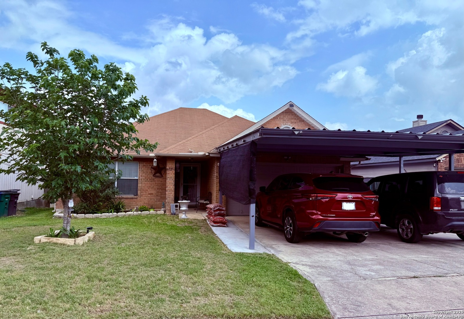 a view of a car parked in front of a house
