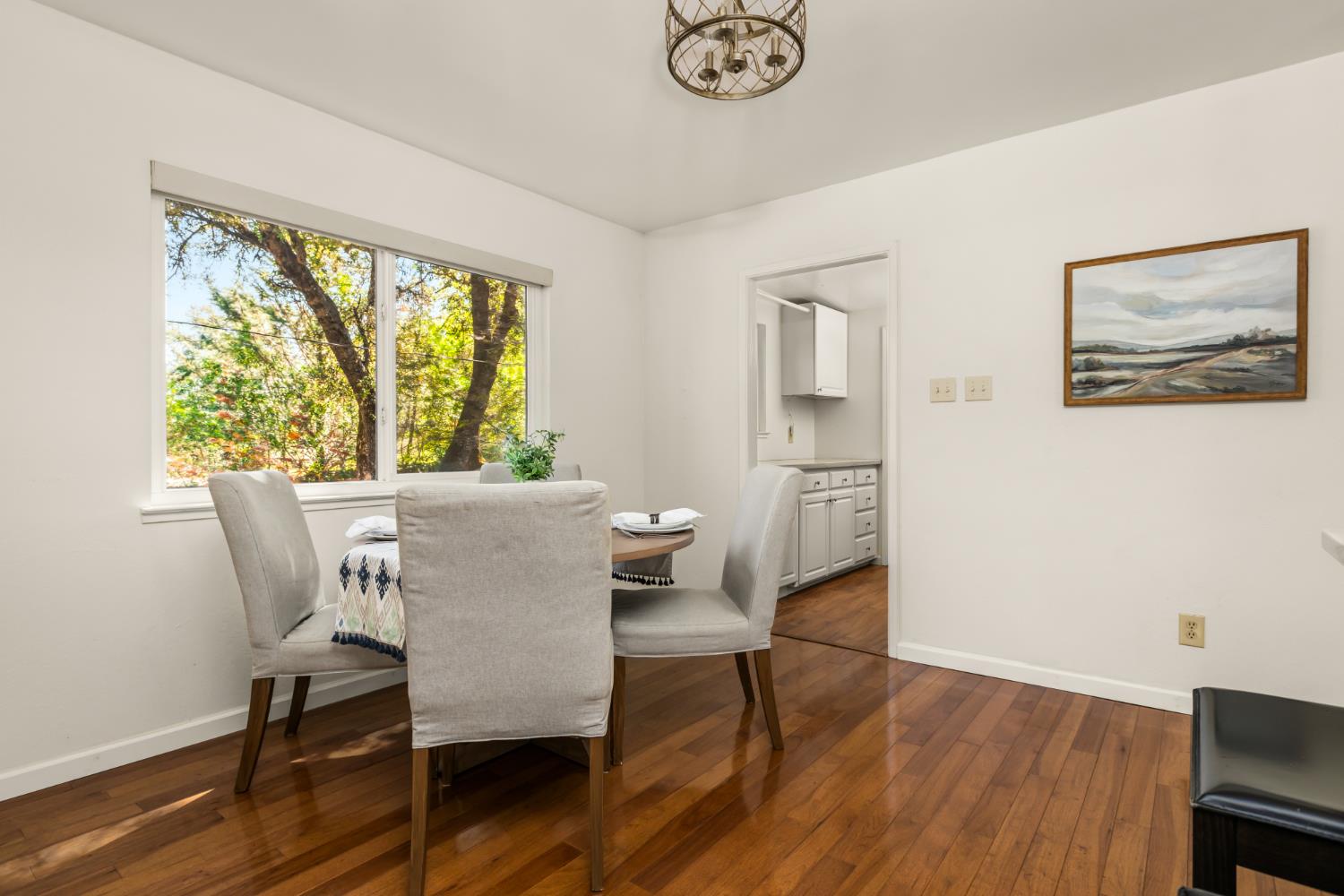 10875 Spenceville Road Penn Valley, CA 95946 - Photo 9 of 49 a view of a dining room with furniture window and wooden floor