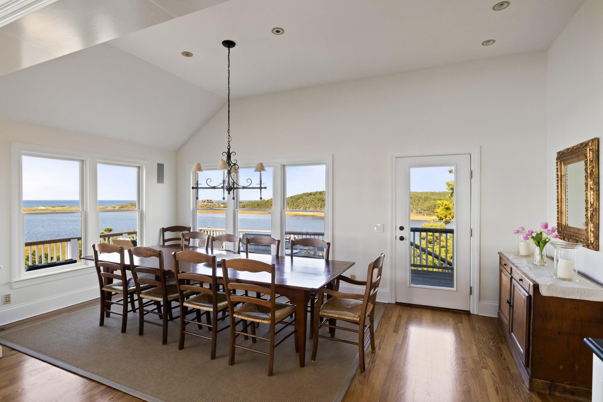 1035 Chequessett Neck Road Wellfleet, MA 02667 - Photo 17 of 86 a view of a dining room with furniture window and outside view