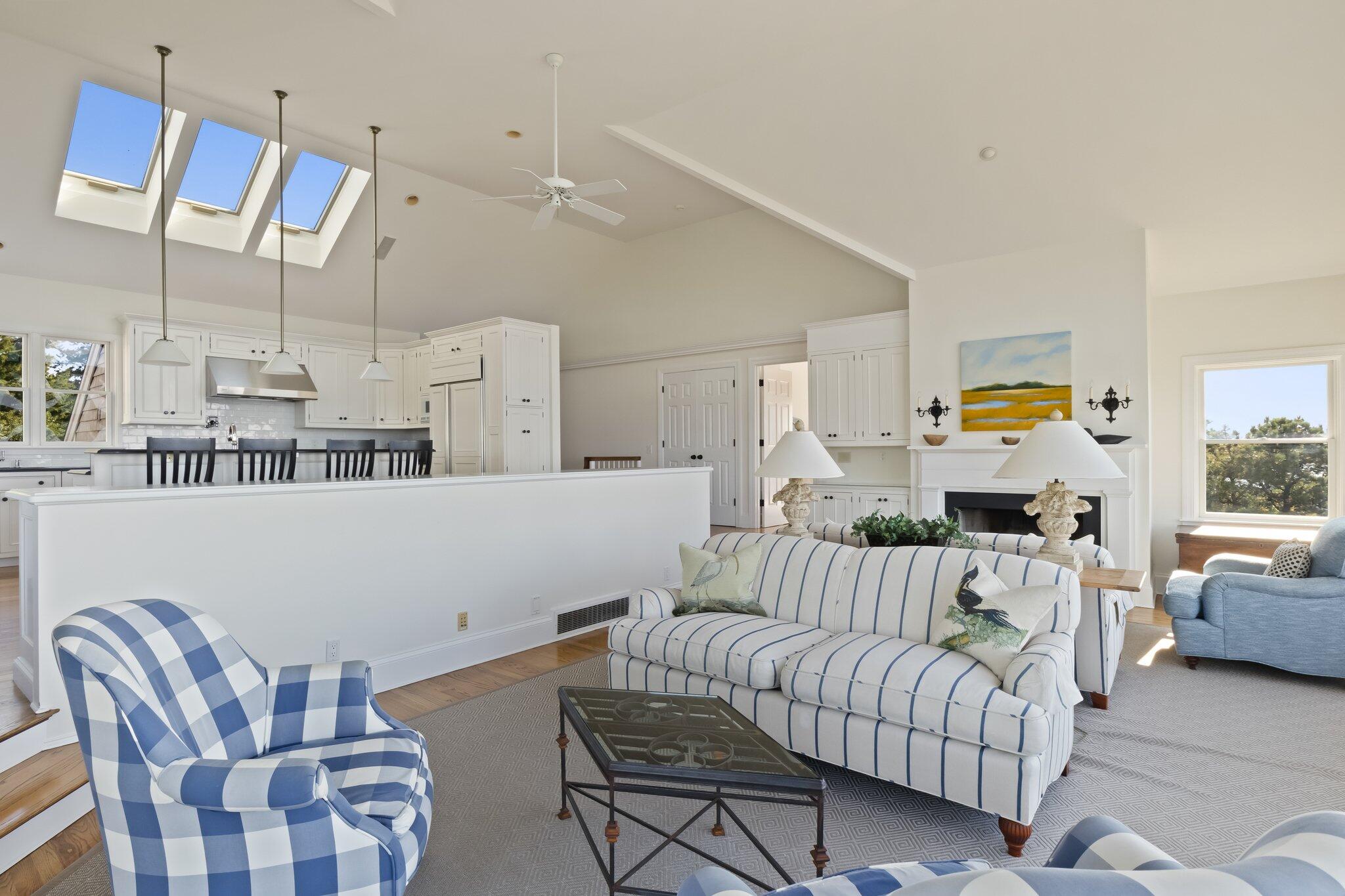 1035 Chequessett Neck Road Wellfleet, MA 02667 - Photo 20 of 86 a living room with furniture and a chandelier