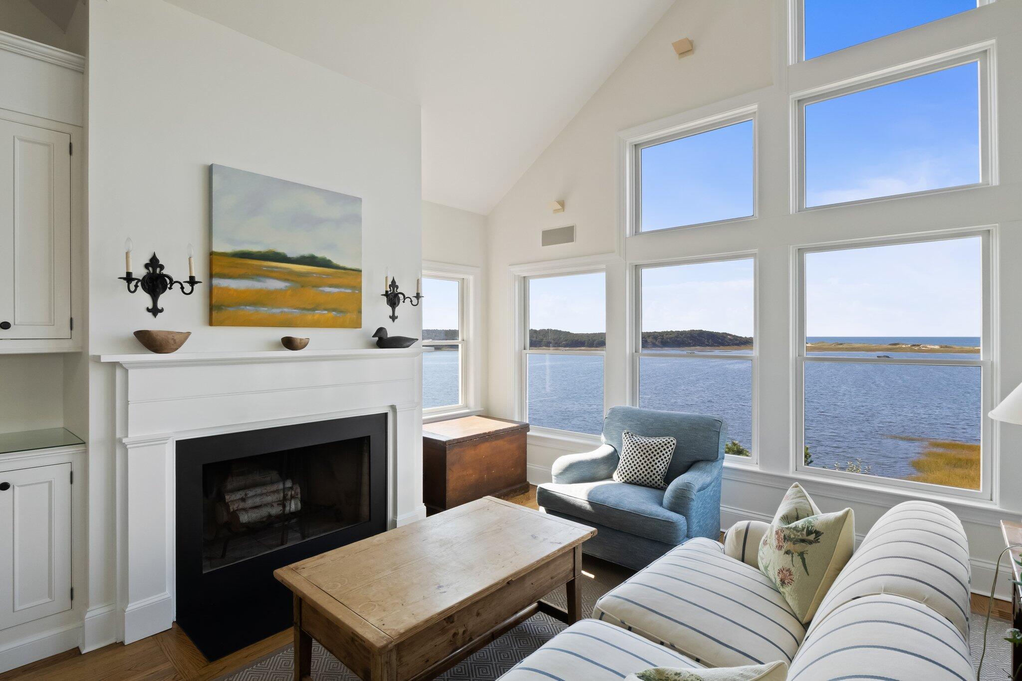 1035 Chequessett Neck Road Wellfleet, MA 02667 - Photo 23 of 86 a living room with furniture or outdoor view and a fireplace