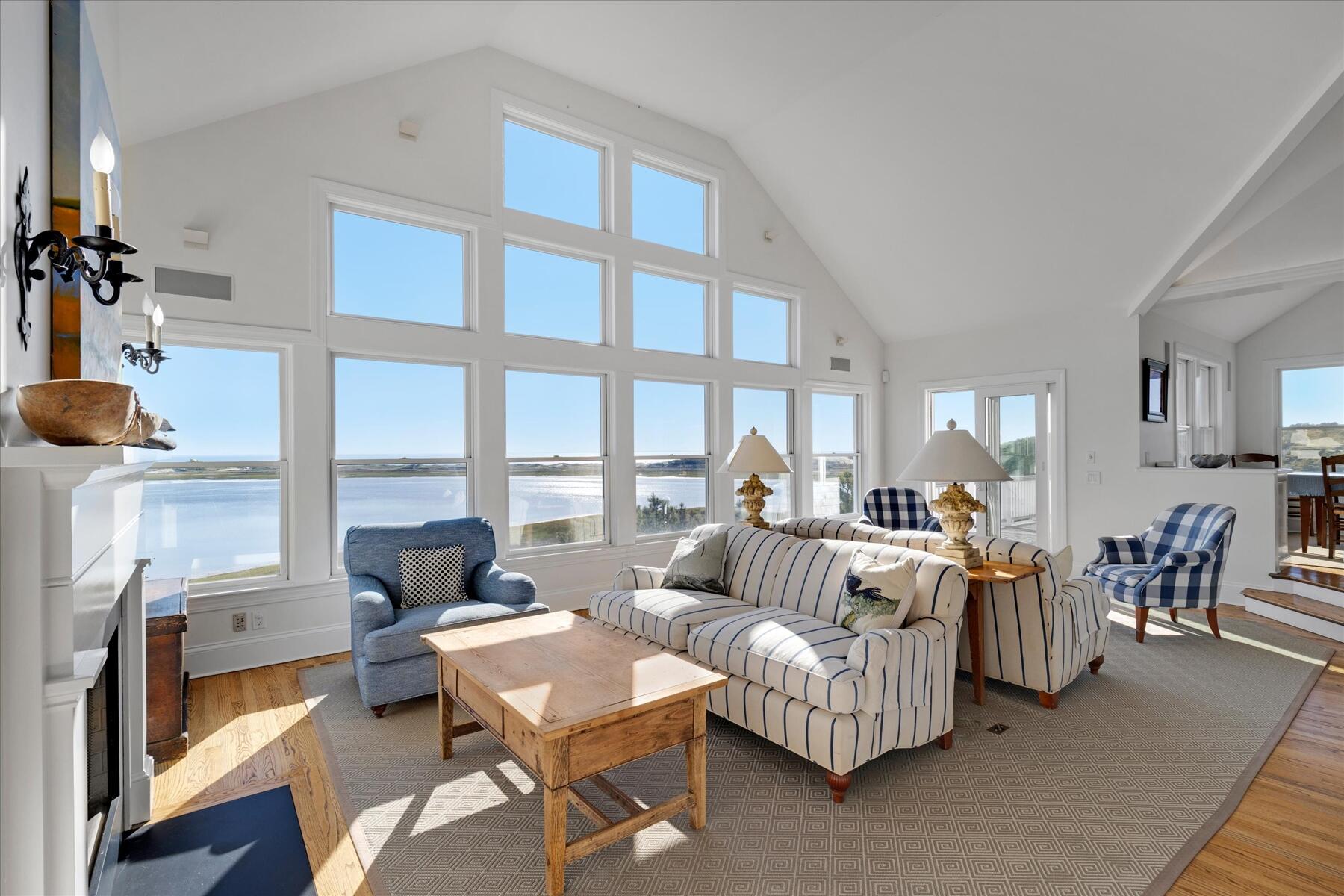 1035 Chequessett Neck Road Wellfleet, MA 02667 - Photo 24 of 86 a living room with furniture and a large window