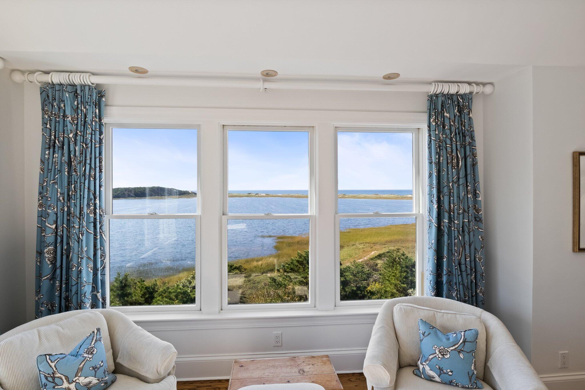 1035 Chequessett Neck Road Wellfleet, MA 02667 - Photo 27 of 86 a view of a large window with chair and table
