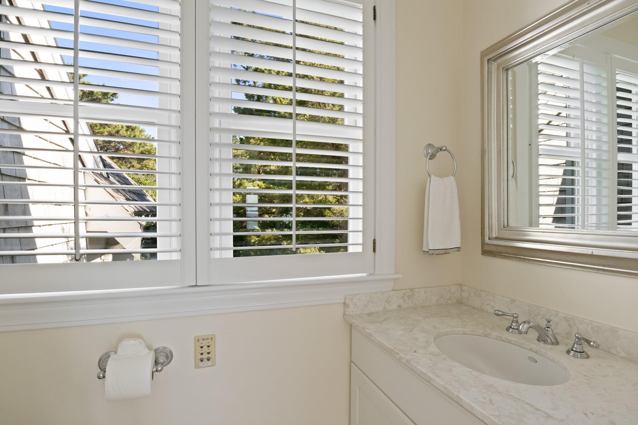 1035 Chequessett Neck Road Wellfleet, MA 02667 - Photo 33 of 86 a bathroom with a sink and a window