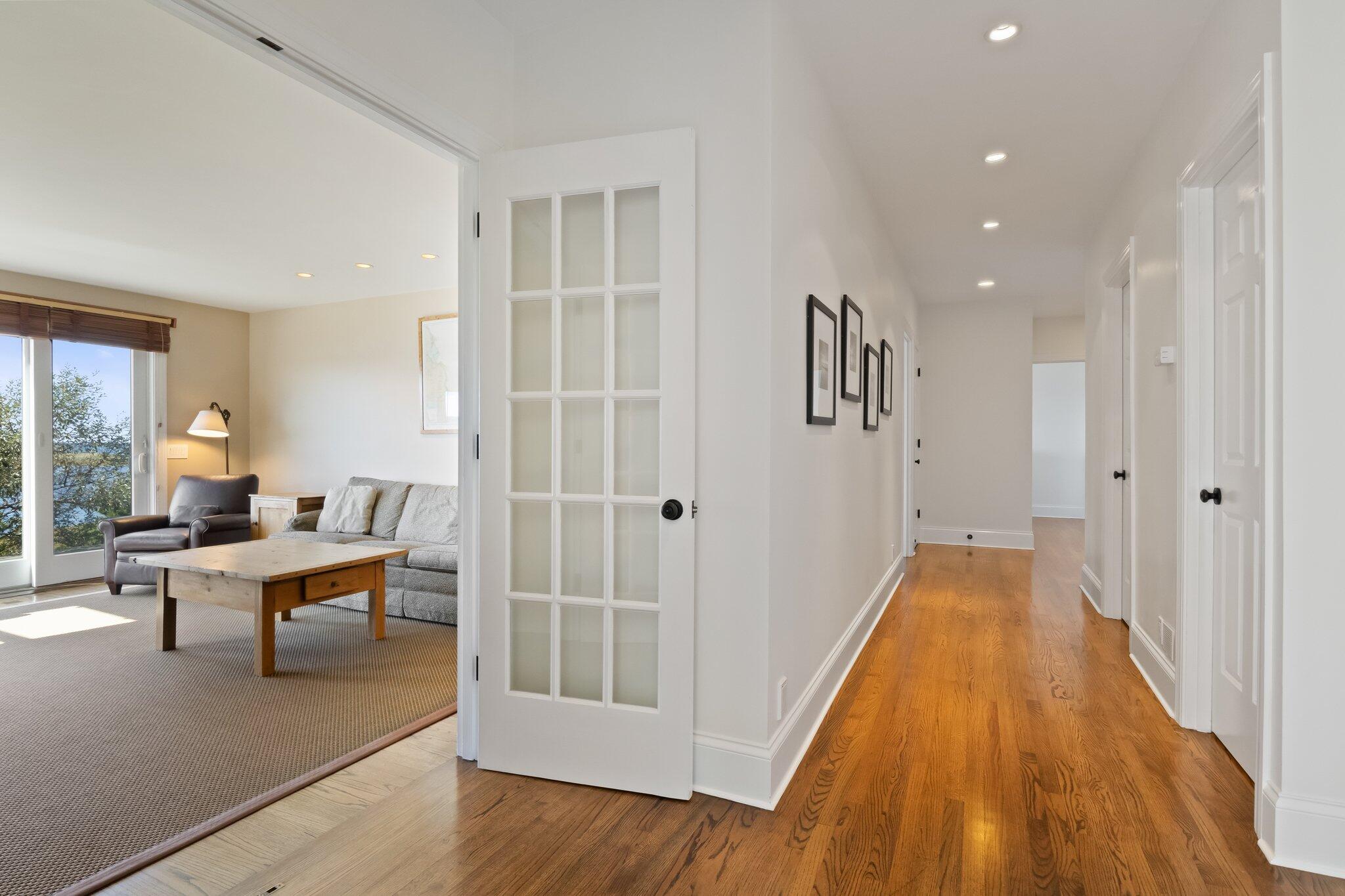 1035 Chequessett Neck Road Wellfleet, MA 02667 - Photo 37 of 86 a spacious bedroom with a bed and wooden floor