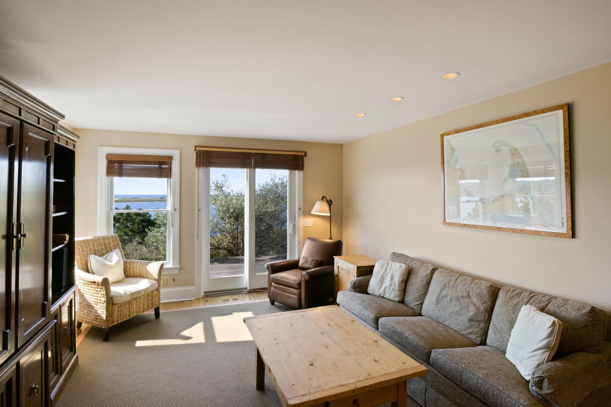 1035 Chequessett Neck Road Wellfleet, MA 02667 - Photo 38 of 86 a living room with furniture and a large window