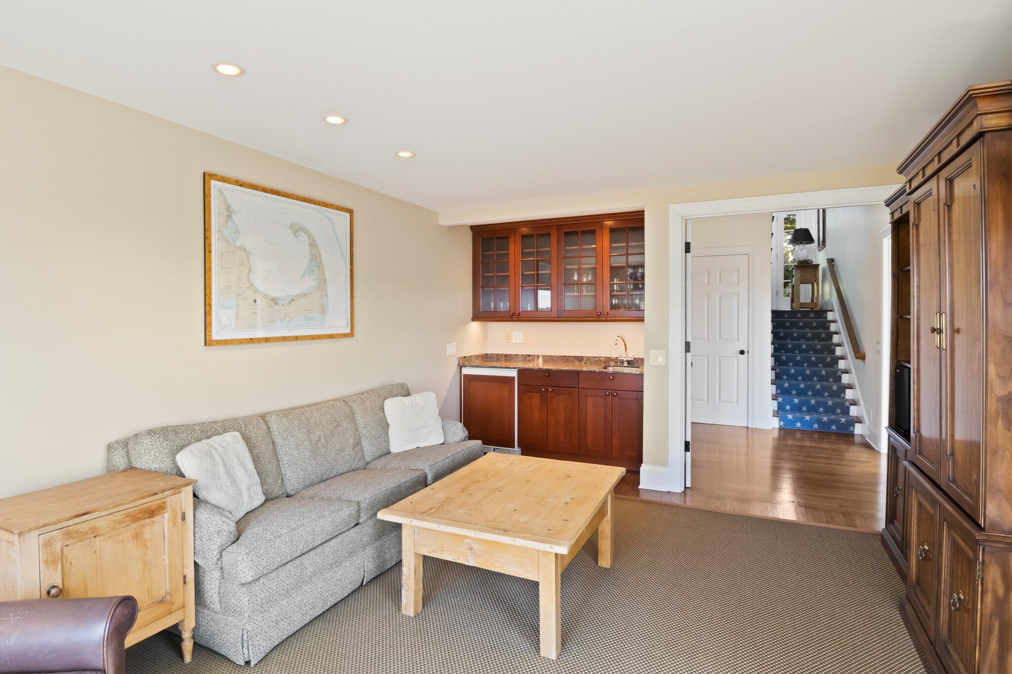 1035 Chequessett Neck Road Wellfleet, MA 02667 - Photo 40 of 86 a living room with furniture a rug and a window