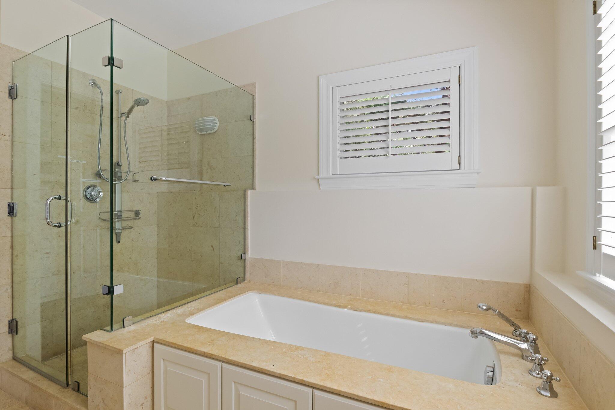 1035 Chequessett Neck Road Wellfleet, MA 02667 - Photo 46 of 86 a bathroom with a tub a sink and shower