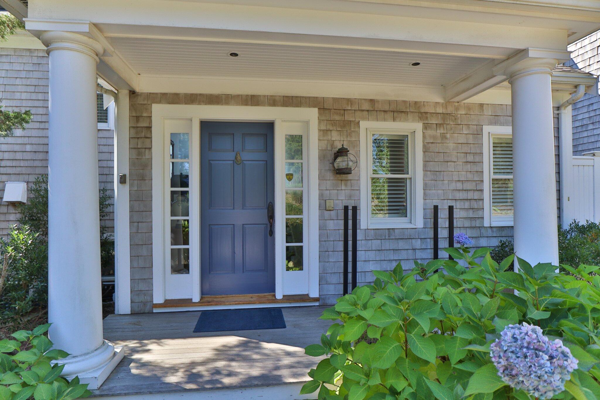 1035 Chequessett Neck Road Wellfleet, MA 02667 - Photo 5 of 86 a front view of a house with a yard