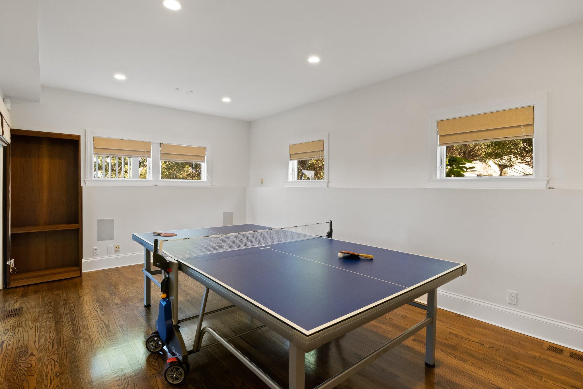 1035 Chequessett Neck Road Wellfleet, MA 02667 - Photo 52 of 86 a room with stainless steel appliances wooden floor and a dining table