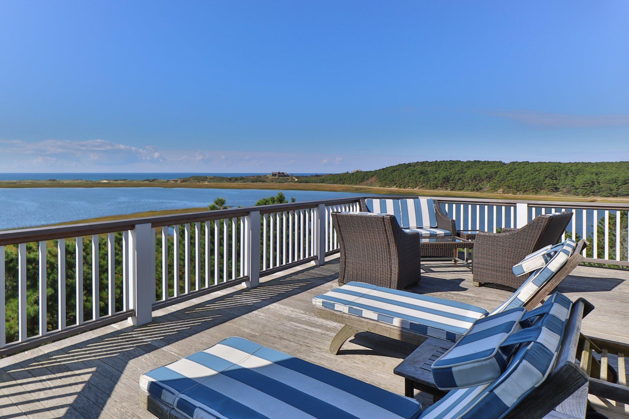 1035 Chequessett Neck Road Wellfleet, MA 02667 - Photo 60 of 86 a view of balcony with wooden floor and seating space