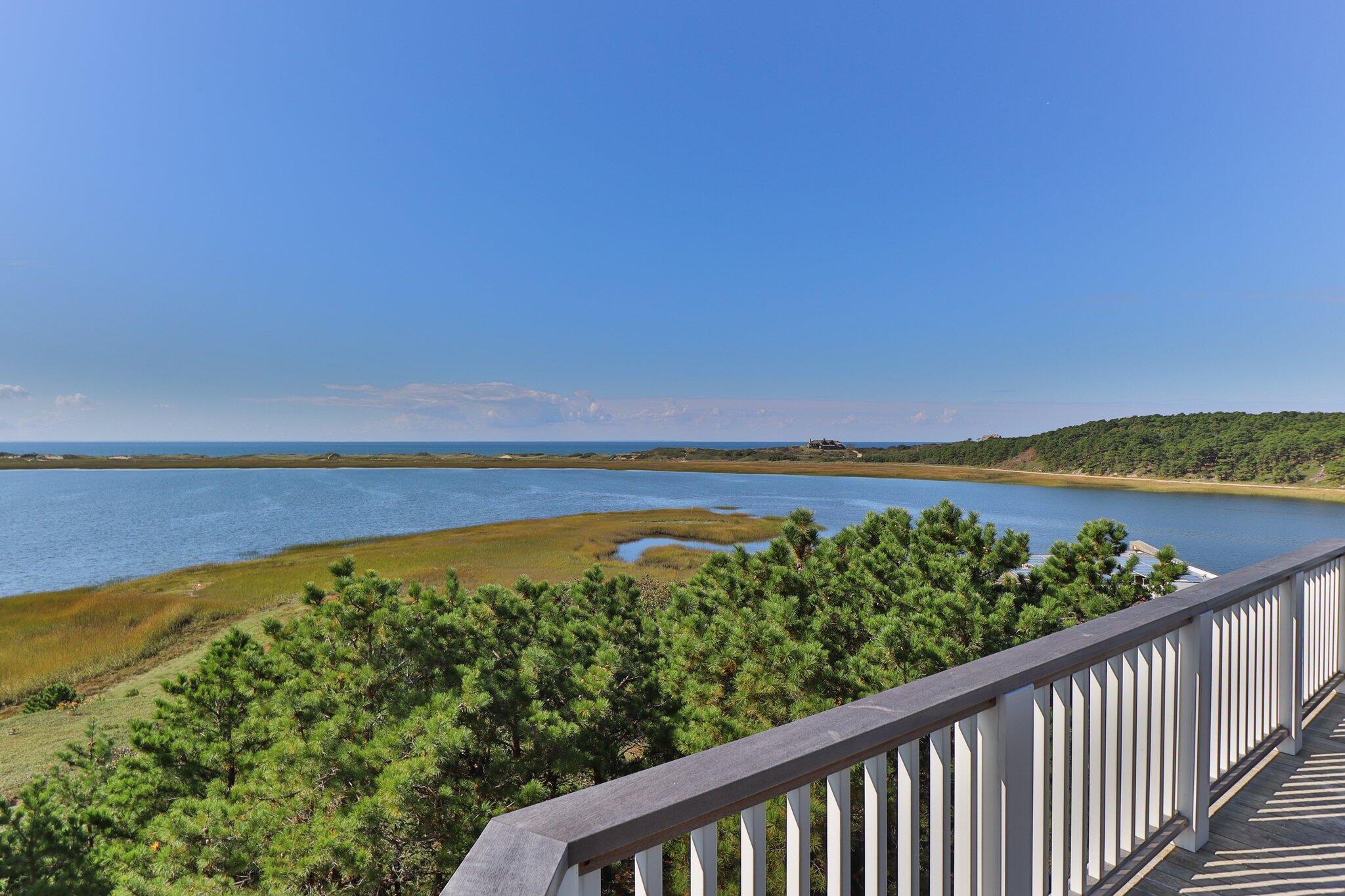 1035 Chequessett Neck Road Wellfleet, MA 02667 - Photo 61 of 86 a view of a balcony with an ocean view