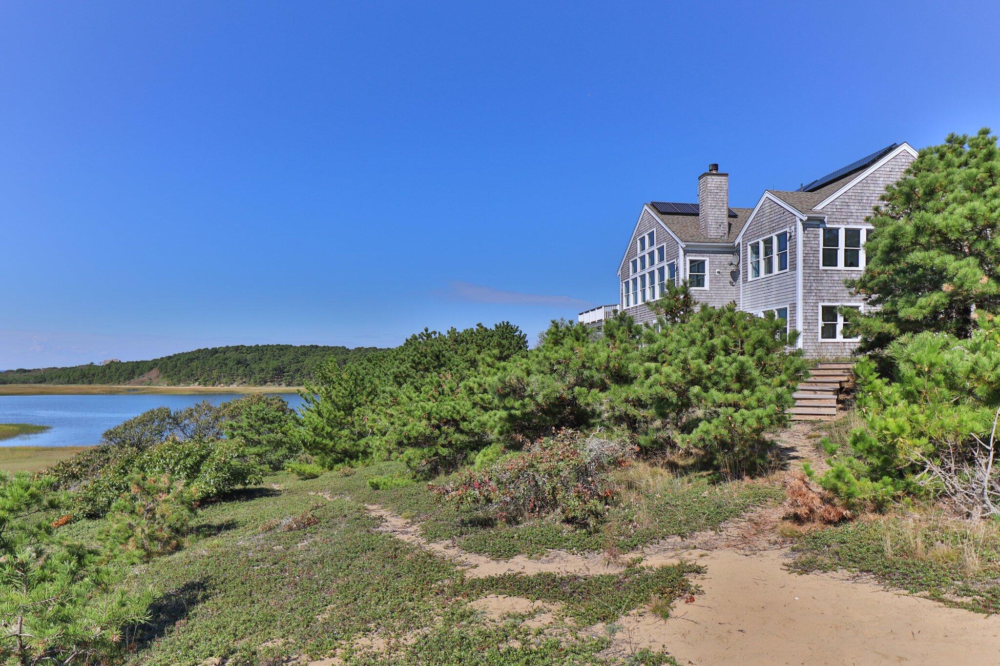 1035 Chequessett Neck Road Wellfleet, MA 02667 - Photo 72 of 86 a view of a city with tall buildings in front of it