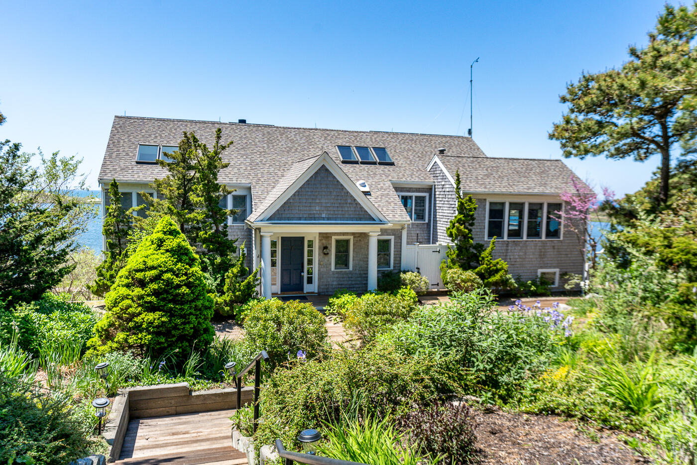 1035 Chequessett Neck Road Wellfleet, MA 02667 - Photo 76 of 86 a front view of a house with a yard