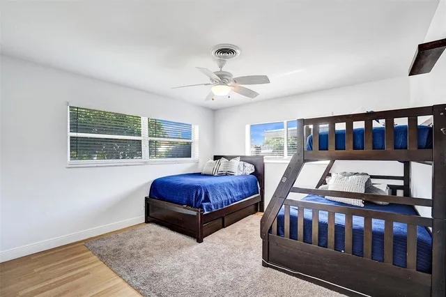 a bedroom with furniture window and book shelf