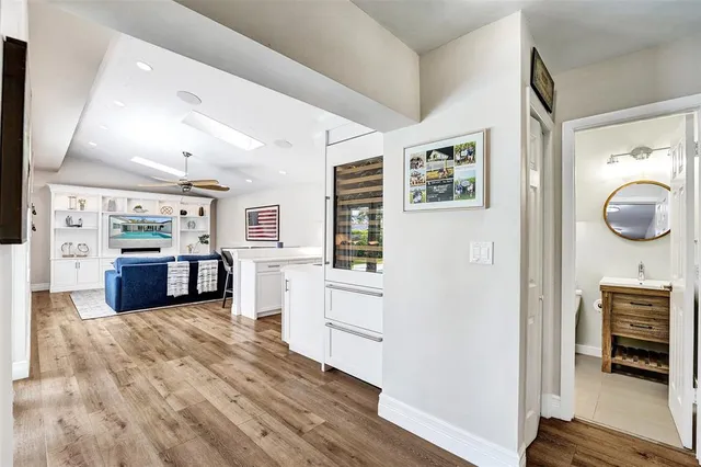 a kitchen with stainless steel appliances granite countertop a refrigerator and a stove top oven