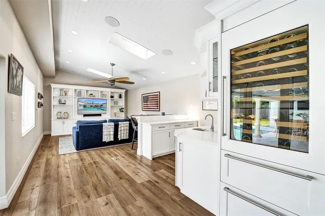 a kitchen with a stove a refrigerator and a cabinets