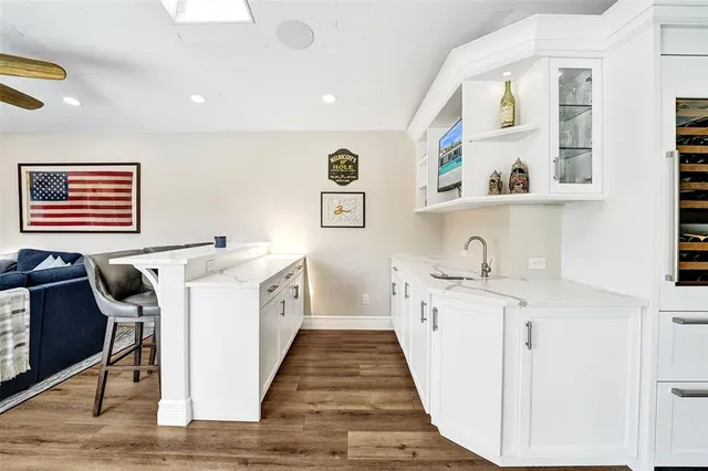 a hallway with cabinets and window