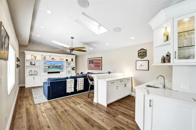 a large kitchen with stainless steel appliances granite countertop a stove oven and a refrigerator