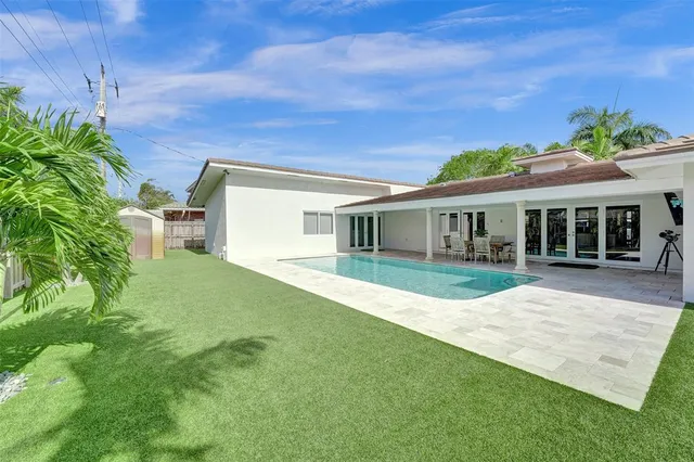 a view of house with a yard