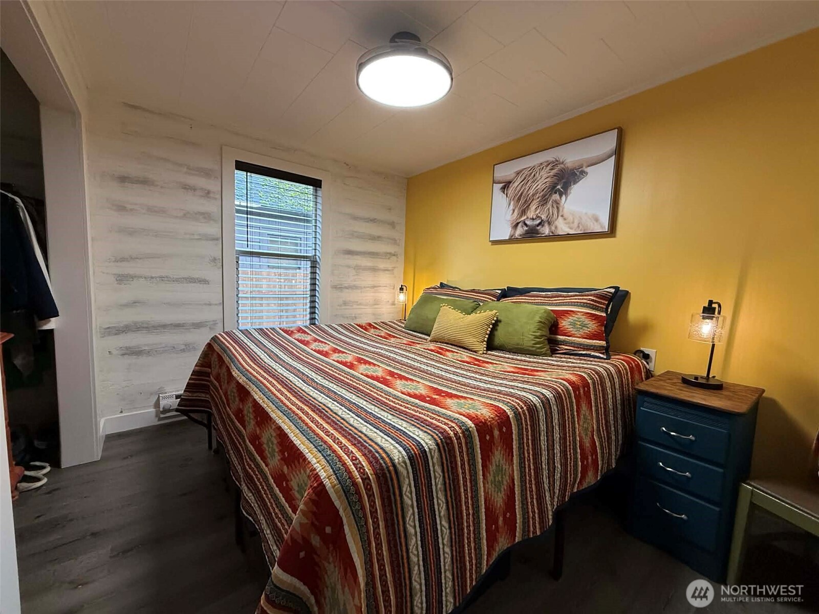 254 5th Street Morton, WA 98356 - Photo 11 of 23 a bedroom with bed and wooden floor