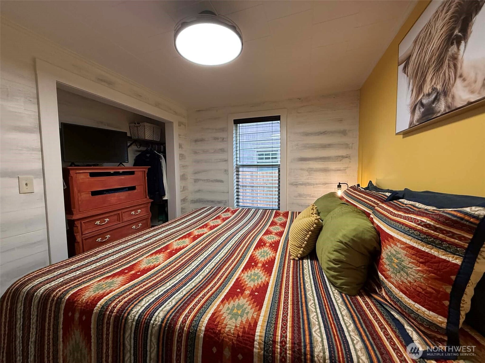 254 5th Street Morton, WA 98356 - Photo 12 of 23 a bedroom with a bed and a television