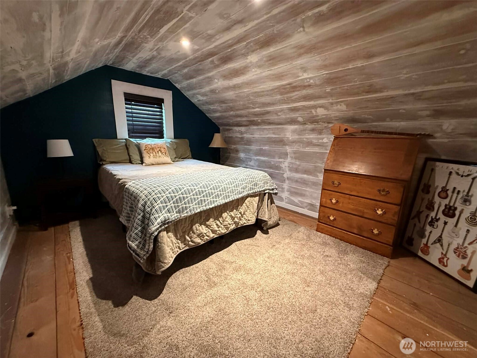 254 5th Street Morton, WA 98356 - Photo 15 of 23 a bedroom with a bed and a mirror