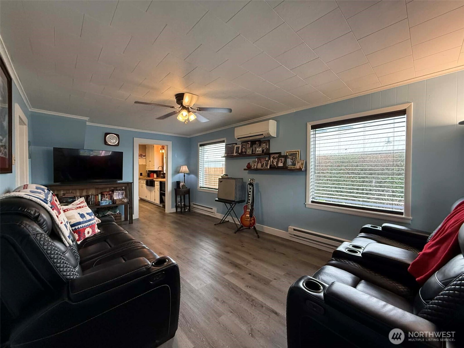 254 5th Street Morton, WA 98356 - Photo 8 of 23 a living room with furniture gym equipment and a flat screen tv