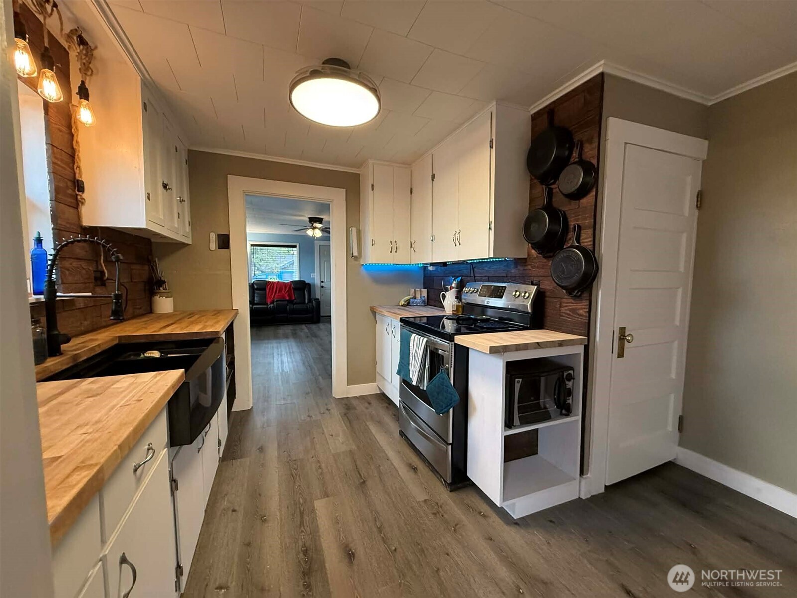 254 5th Street Morton, WA 98356 - Photo 9 of 23 a kitchen with a stove and a refrigerator