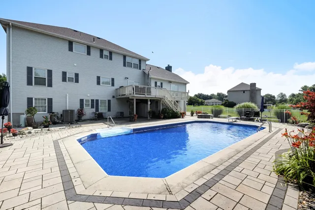 a view of a swimming pool with a lounge chair