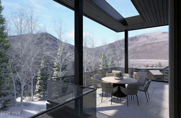 a kitchen with a table and chairs