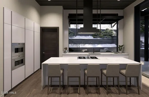 a kitchen with a table and chairs