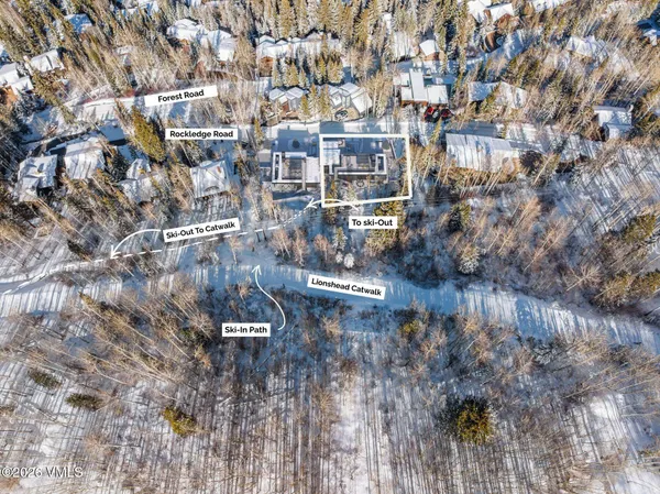 a dining room with furniture a fireplace and window