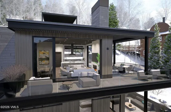 a view of a dining room with a table and chairs