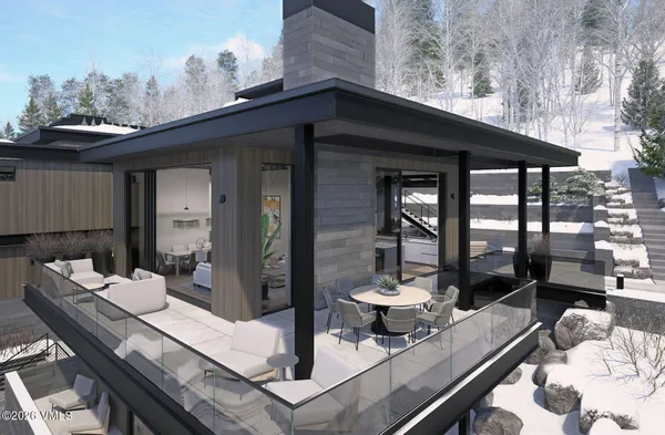 a living room with a table and chairs