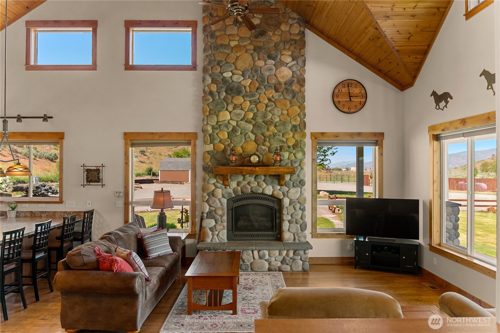 23 George Road Omak, WA 98841 - Photo 11 of 40 a living room with furniture and a fireplace