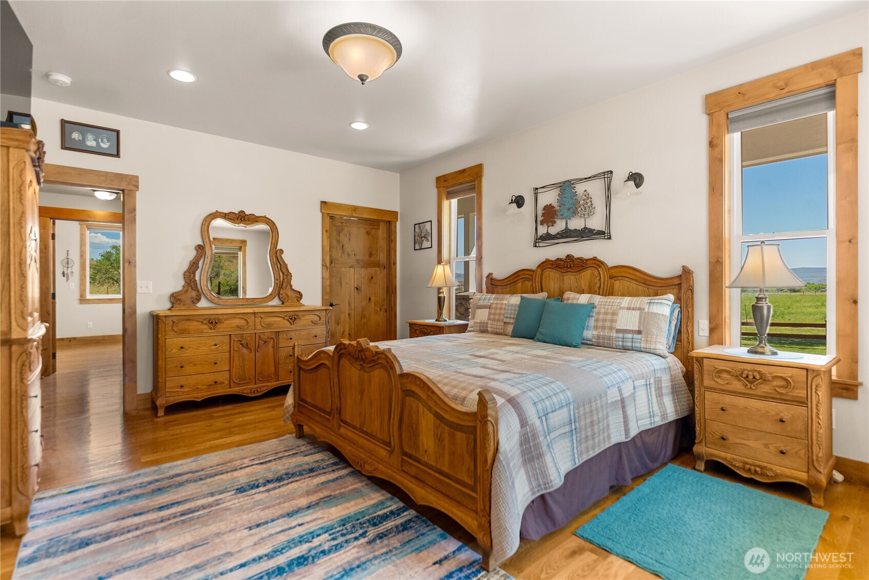 23 George Road Omak, WA 98841 - Photo 18 of 40 a bedroom with a bed and wooden floor
