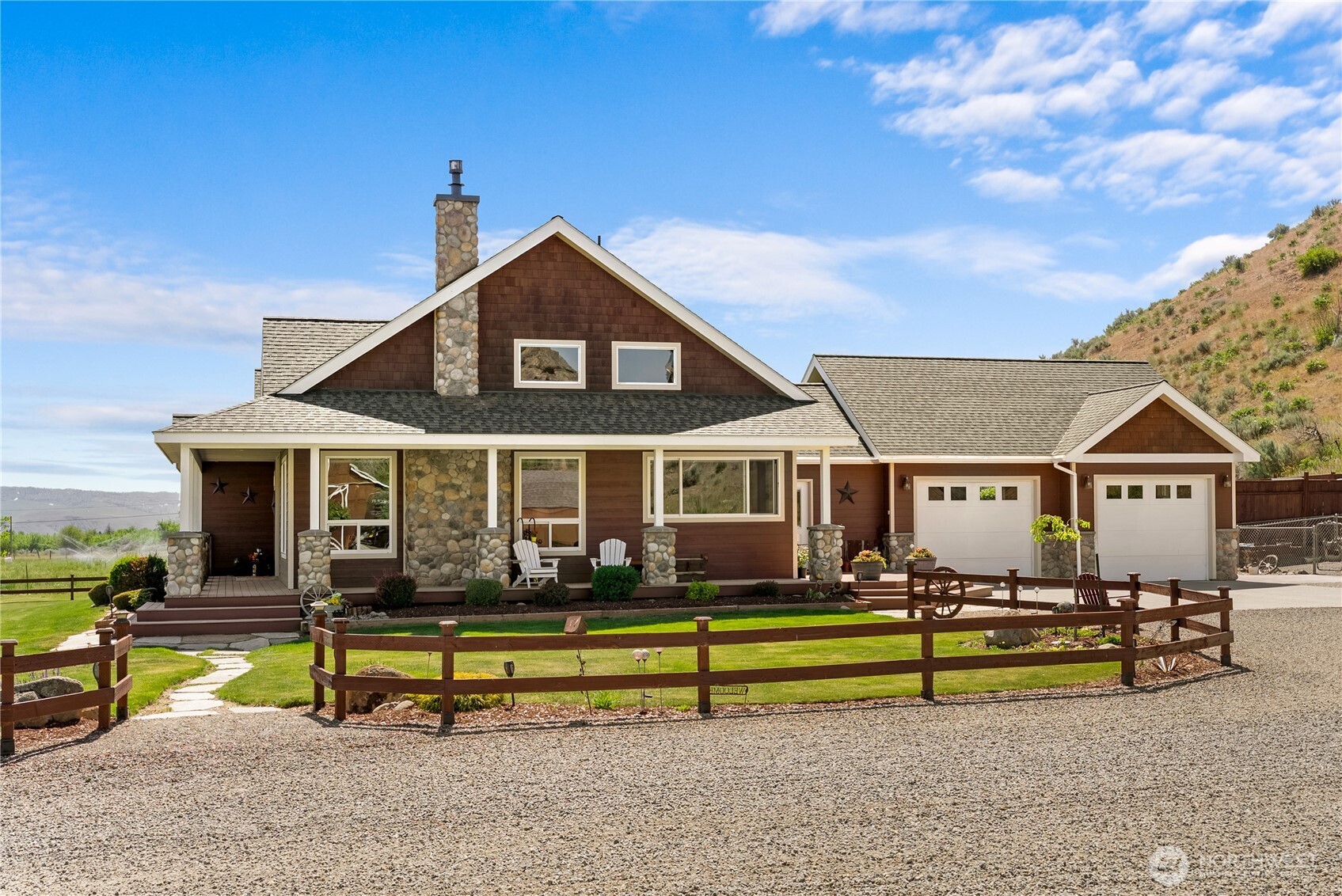 23 George Road Omak, WA 98841 - Photo 32 of 40 a front view of a house with swimming pool and porch