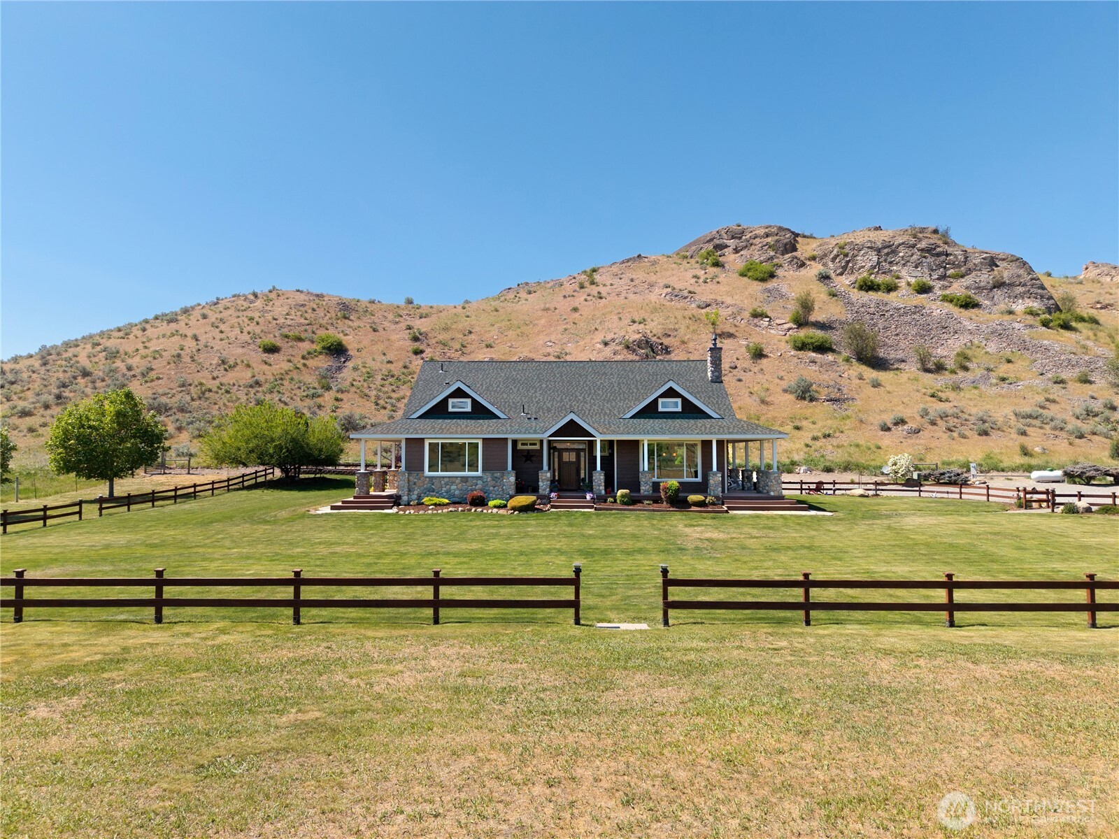 23 George Road Omak, WA 98841 - Photo 35 of 40 a view of a big house with a big yard and large trees
