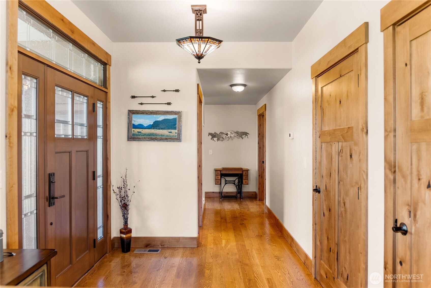 23 George Road Omak, WA 98841 - Photo 10 of 40 a view of a hallway with wooden floor and staircase
