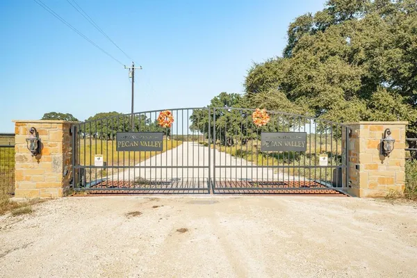 a view of a garden with iron fence