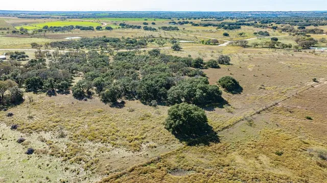 an aerial view of beach and yard