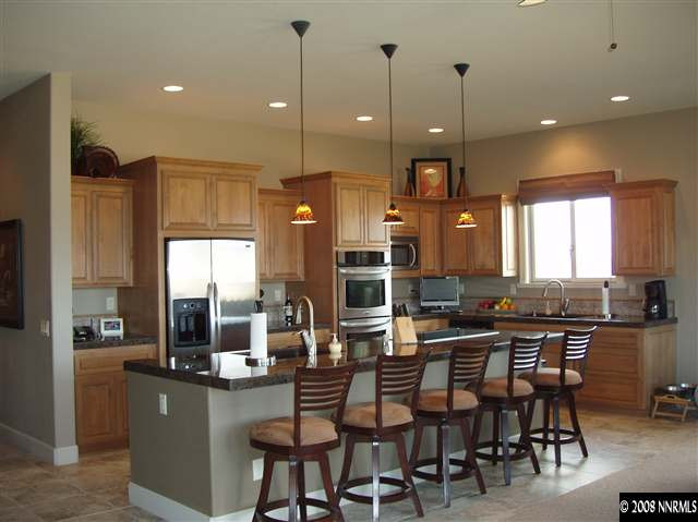 1215 Springer Court Reno, NV 89511 - Photo 3 of 9 a dining table with chairs and window
