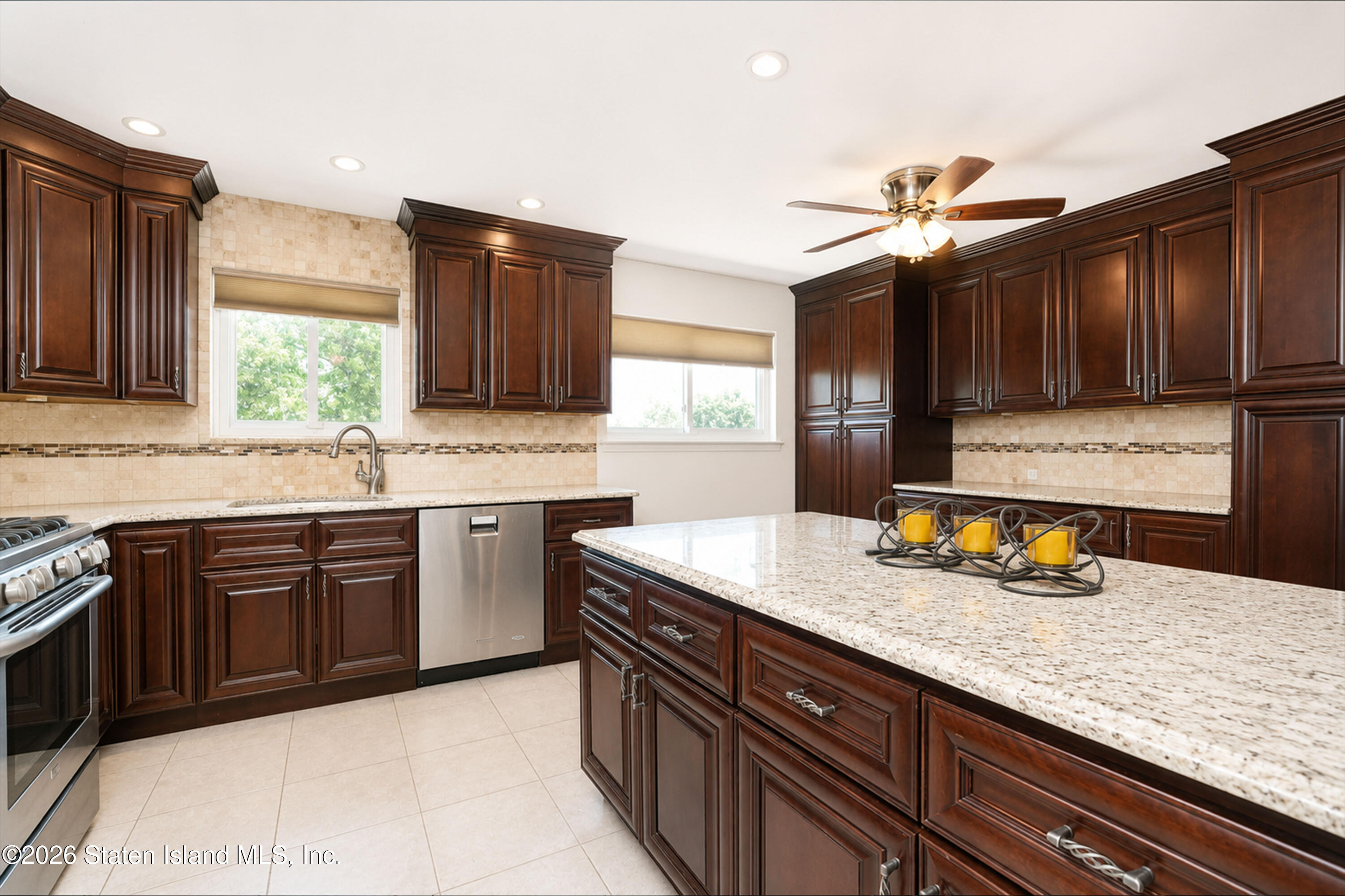 37 Middle Loop Road Staten Island, NY 10308 - Photo 15 of 38 a kitchen with a sink a stove and cabinets