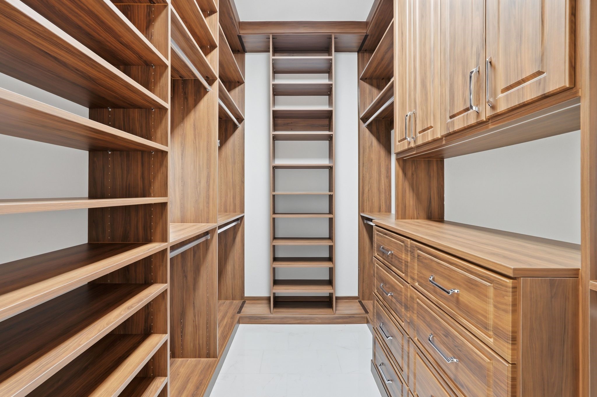 16081 Forest Mill Road Willis, TX 77378 - Photo 22 of 37 The impressive second closet feels like a private dressing room, complete with custom built-ins, abundant storage, and organization space tailored for everyday luxury.