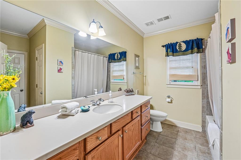 14 Laurel Ridge Lane Big Canoe, GA 30143 - Photo 52 of 72 a bathroom with a sink a toilet and a mirror